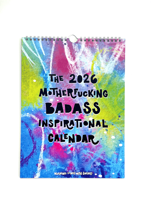 Colorful calendar with text 'The 2026 MotherFucking BADASS Inspirational Calendar' on a white background. Swearing adult language